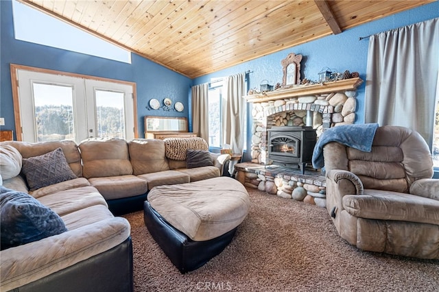 living room featuring vaulted ceiling with beams, wood ceiling, carpet floors, and a wood stove