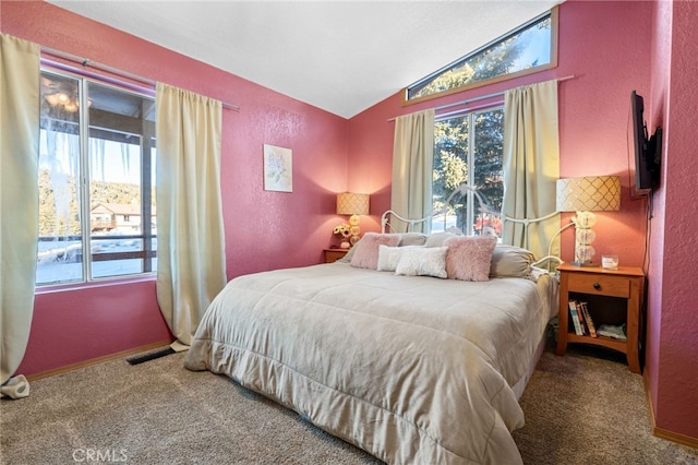 carpeted bedroom with vaulted ceiling