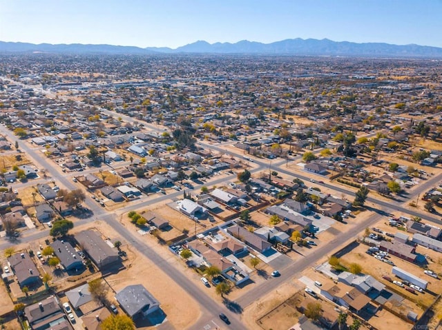 birds eye view of property with a mountain view