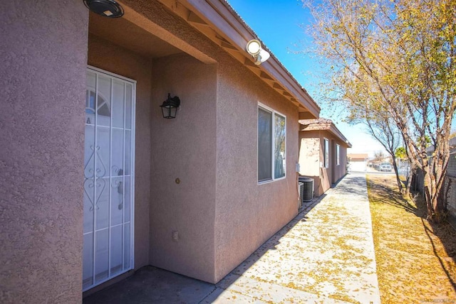 view of property exterior with central AC