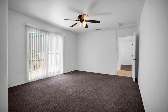 carpeted empty room featuring ceiling fan