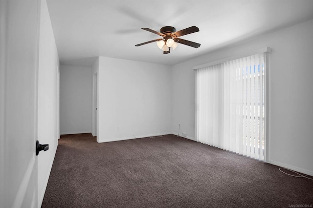 carpeted empty room featuring ceiling fan