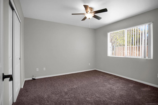 unfurnished bedroom with ceiling fan, a closet, and carpet