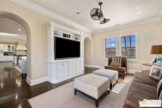 living room with dark wood-type flooring and crown molding