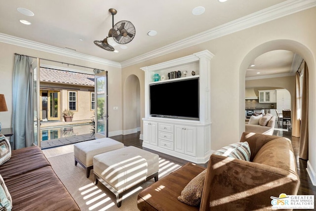 living room featuring dark hardwood / wood-style flooring and crown molding