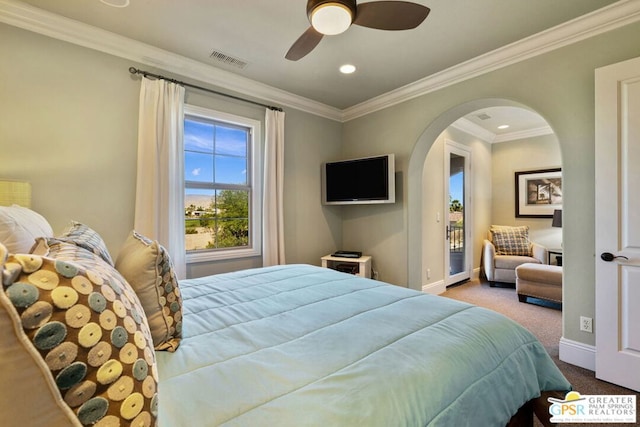 bedroom featuring crown molding, carpet floors, and ceiling fan