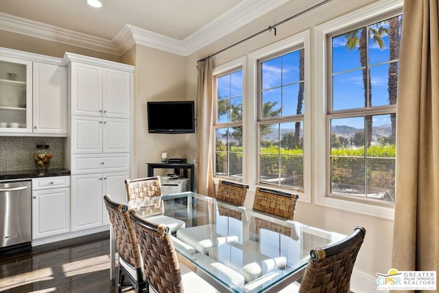 dining space featuring dark wood-type flooring and ornamental molding