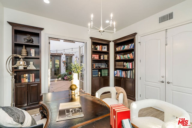 living area with a notable chandelier