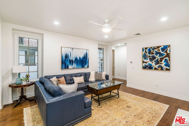 living room with hardwood / wood-style flooring and ceiling fan