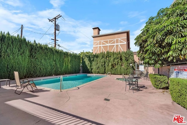 view of pool featuring a patio