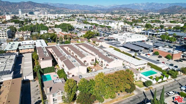 birds eye view of property with a mountain view