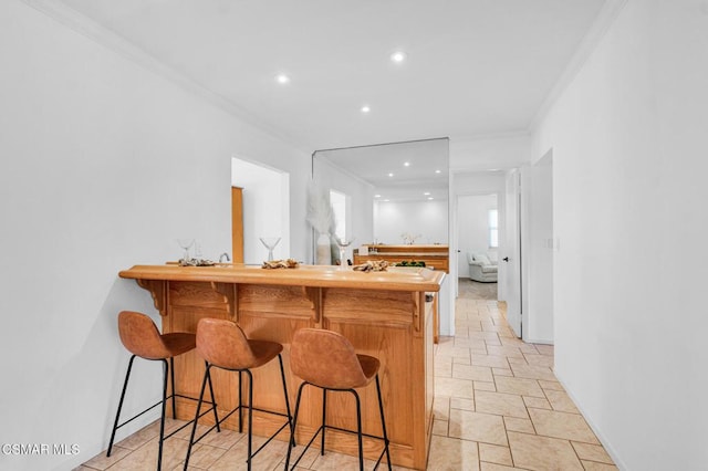 bar featuring crown molding