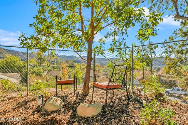 view of patio / terrace featuring a mountain view