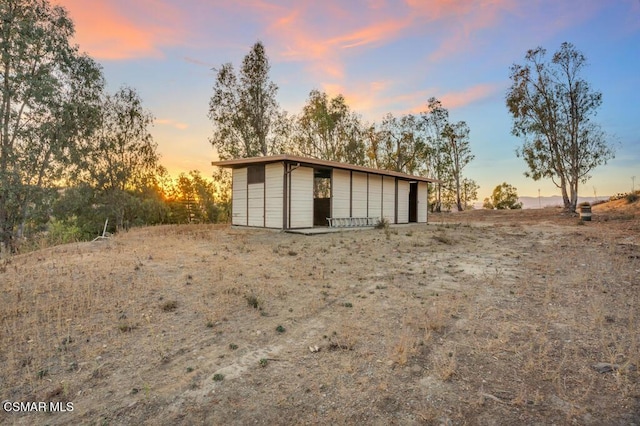 outdoor structure at dusk with a garage