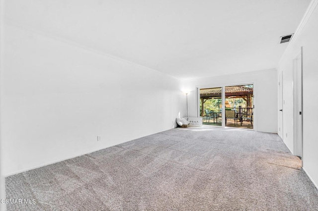 carpeted empty room with crown molding