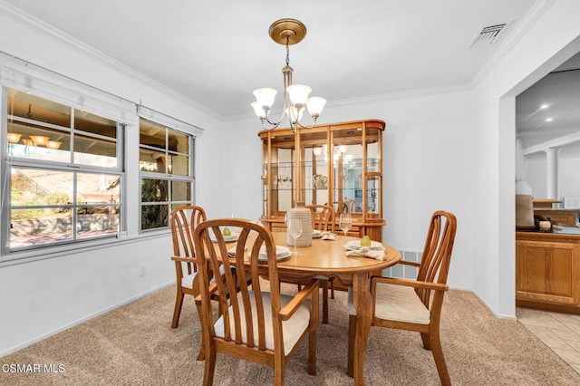 tiled dining area with a notable chandelier and crown molding