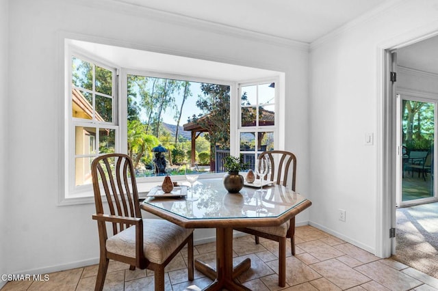 tiled dining room with crown molding