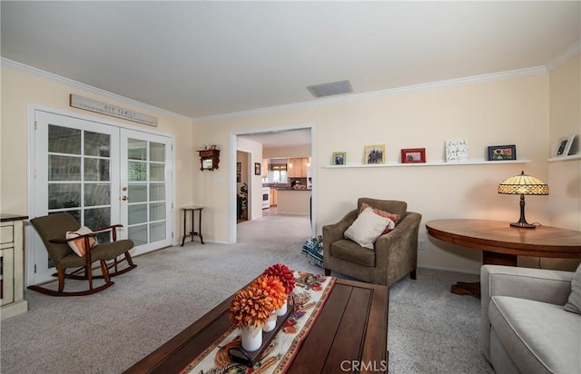 carpeted living room featuring crown molding and french doors