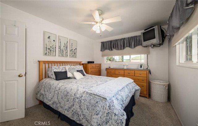 carpeted bedroom featuring ceiling fan