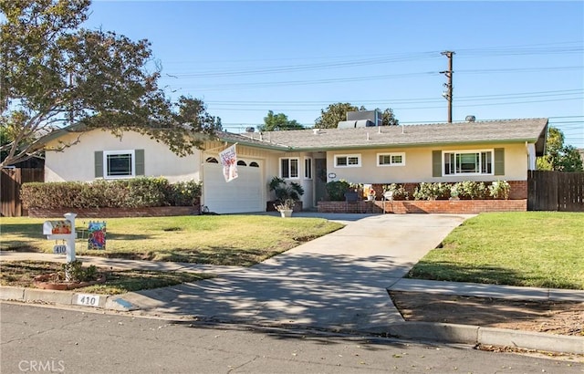 ranch-style home featuring a front yard and a garage