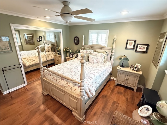 bedroom featuring dark hardwood / wood-style flooring, crown molding, a closet, and ceiling fan