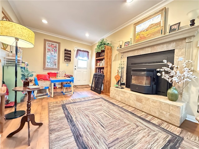 living room with ornamental molding and hardwood / wood-style floors