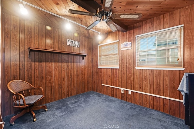 unfurnished room with ceiling fan, carpet floors, wooden walls, and wooden ceiling