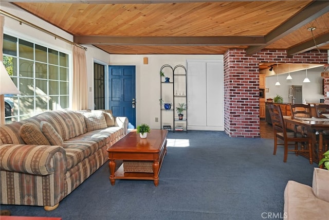 carpeted living room featuring beam ceiling and wood ceiling