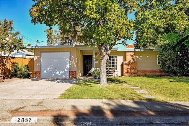 single story home with a front yard and a garage