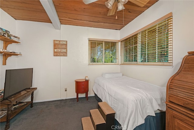 carpeted bedroom with beam ceiling, ceiling fan, and wood ceiling