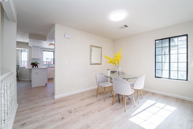 dining area featuring light hardwood / wood-style flooring