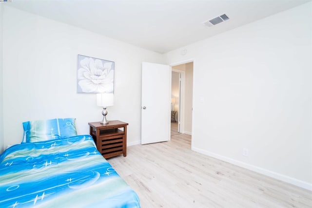 bedroom with light wood-type flooring