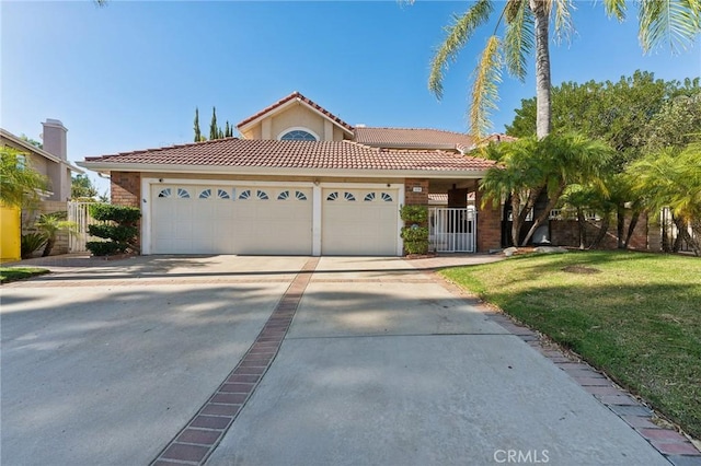 mediterranean / spanish-style home featuring a garage and a front lawn