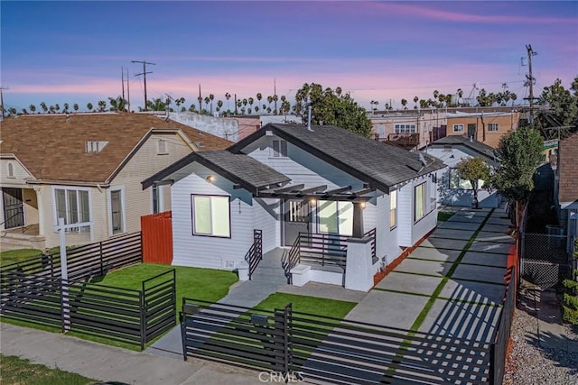 view of front of home featuring a lawn