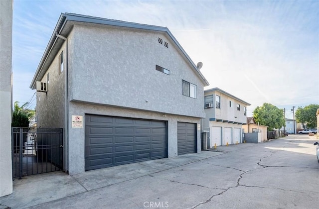 view of side of property featuring a garage