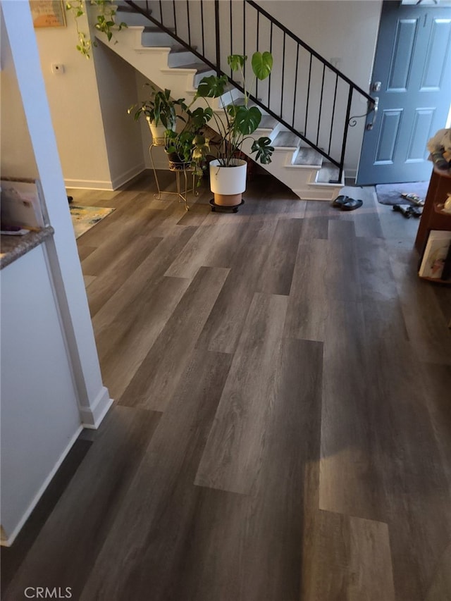 staircase with hardwood / wood-style flooring