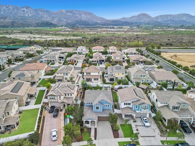 birds eye view of property featuring a mountain view