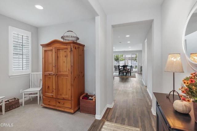 hall with hardwood / wood-style floors