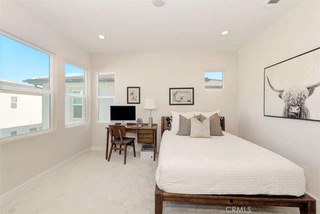 bedroom featuring light carpet