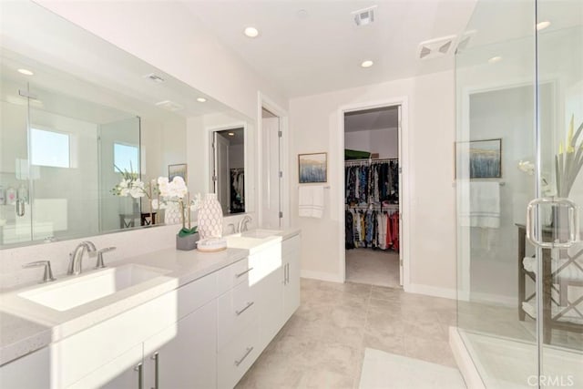 bathroom featuring vanity and a shower with door