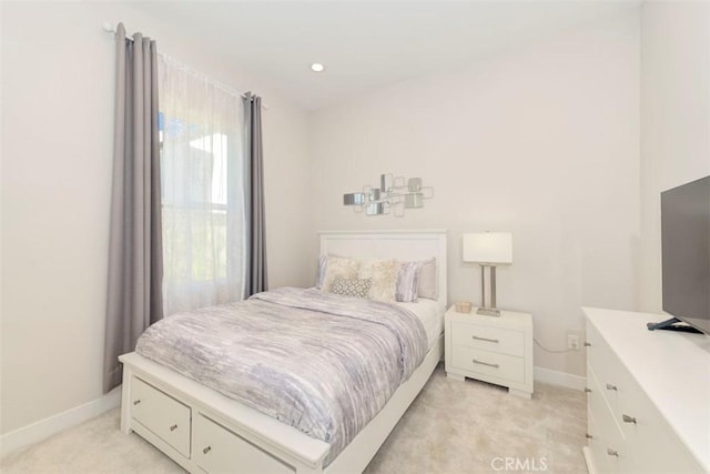 bedroom featuring light colored carpet