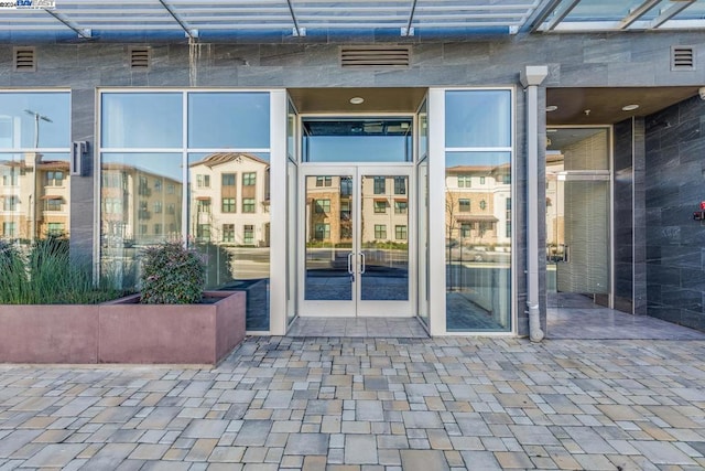 doorway to property featuring a patio area