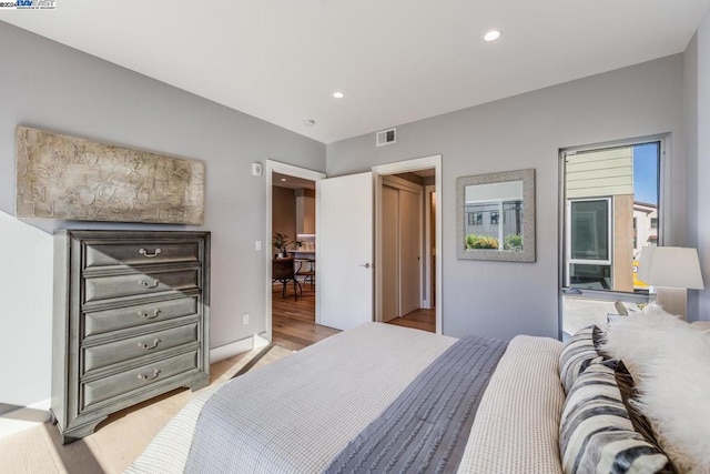 bedroom with light wood-type flooring