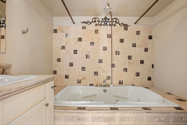 bathroom featuring vanity and tiled bath