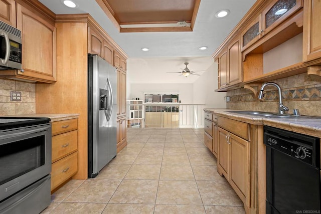 kitchen with tasteful backsplash, sink, ceiling fan, stainless steel appliances, and light tile patterned floors