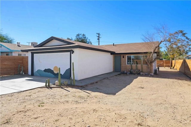 62044 Valley View Cir, Joshua Tree, CA 92252 - view of front of house featuring a garage, concrete driveway, and stucco siding