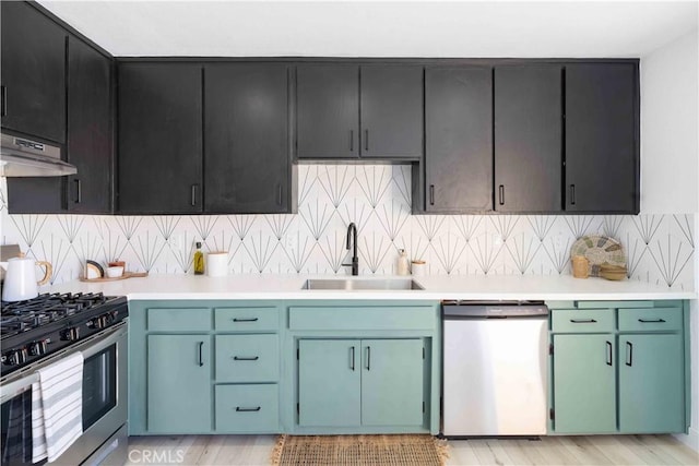 62044 Valley View Cir, Joshua Tree, CA 92252 - kitchen with stainless steel appliances, light countertops, under cabinet range hood, and backsplash