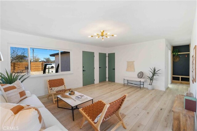 62044 Valley View Cir, Joshua Tree, CA 92252 - living room featuring a chandelier and wood finished floors