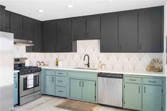 62044 Valley View Cir, Joshua Tree, CA 92252 - kitchen with appliances with stainless steel finishes, under cabinet range hood, light countertops, and recessed lighting