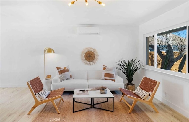 62044 Valley View Cir, Joshua Tree, CA 92252 - living area featuring a wall mounted AC, wood finished floors, and a chandelier